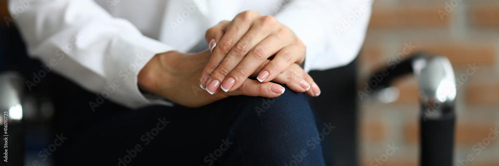 Woman in white blouse sit on chair with her hands folded together on her knees. Professional psychologist conduct session. Treatment of mental illness. Psychological conversation for treatment of Woman in white blouse sit on chair with her hands folded together on her knees. Professional psychologist conduct session. Treatment of mental illness. Psychological conversation for treatment of