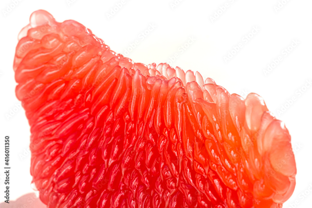 Fresh juicy grapefruit pulp background. Piece of red grapefruit macro close up. Citrus fruit texture wallpaper Fresh juicy grapefruit pulp background. Piece of red grapefruit macro close up. Citrus fruit texture wallpaper