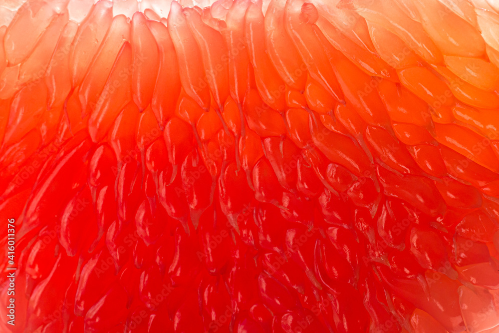 Fresh juicy grapefruit pulp background. Piece of red grapefruit macro close up. Citrus fruit texture wallpaper Fresh juicy grapefruit pulp background. Piece of red grapefruit macro close up. Citrus fruit texture wallpaper