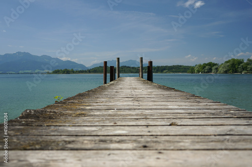 Weathered landing stage shot from low angle with lines converging on the horizon