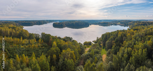 forest and lake in autumn.