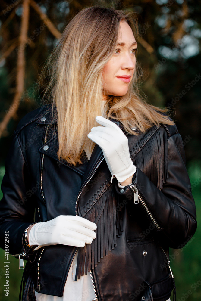 woman in leather biker jacket with fringe