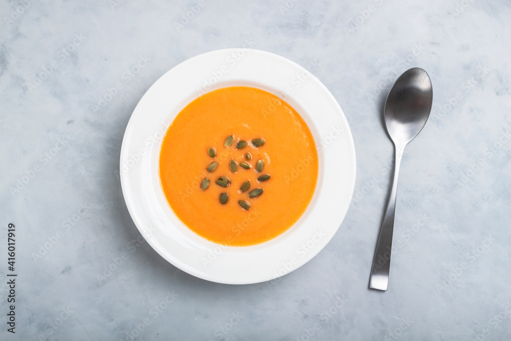 Autumn pumpkin cream soup with seeds is healthy organic vegetarian food Autumn pumpkin cream soup with seeds is healthy organic vegetarian food