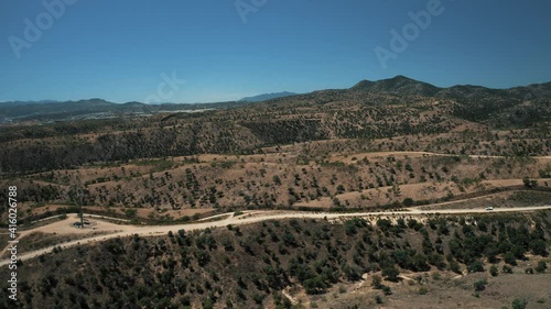 Aerial view of Nogales border area showing border fence separating the United States of America and Mexico with U.S. Border and Customs Protection patrolling border area with their vehicles