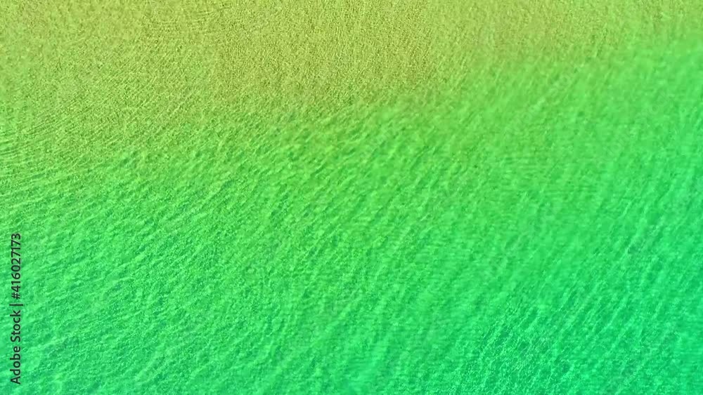 The sparkling clear water flows at the edge of the beach The sparkling clear water flows at the edge of the beach