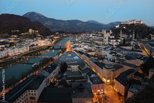Beautiful view of the historic city of Salzburg with Salzach river at night, Austria