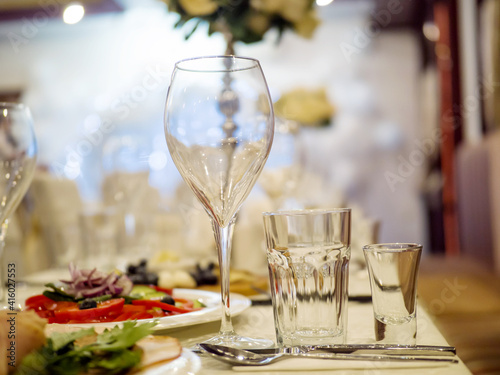 Party table, glass goblet, decoration and serving