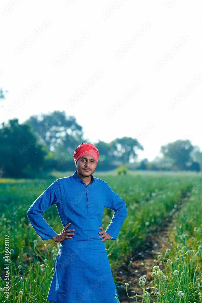 Young indian farmer at onion agriculture field Young indian farmer at onion agriculture field