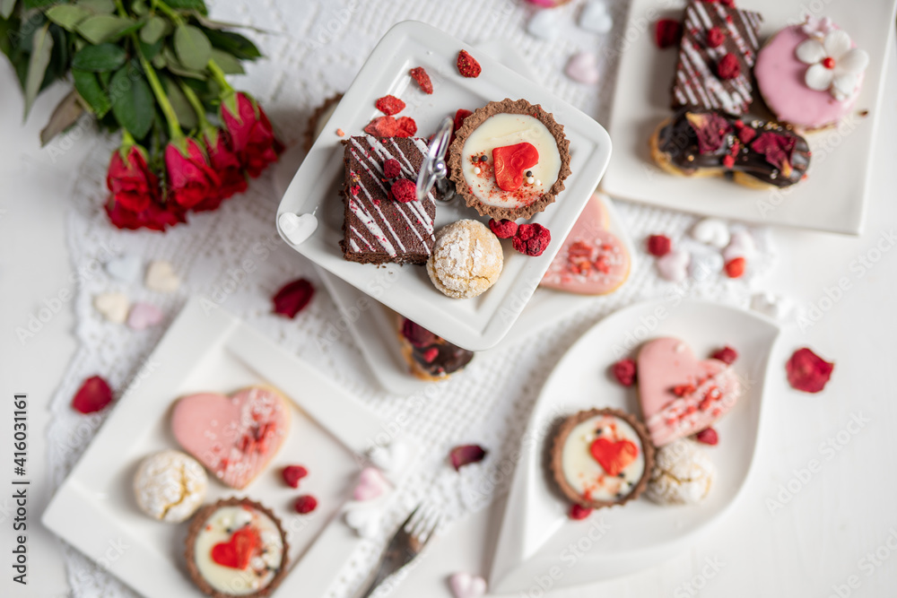 beautiful tasty romantic selection of pink chocolate love heart shape cakes for wedding, mothers day, valentines day, spring flower biscuits tartlet and rose petals beautiful tasty romantic selection of pink chocolate love heart shape cakes for wedding, mothers day, valentines day, spring flower biscuits tartlet and rose petals