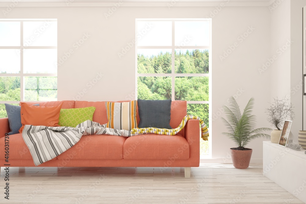 Fototapeta premium White living room with sofa and summer landscape in window. Scandinavian interior design. 3D illustration