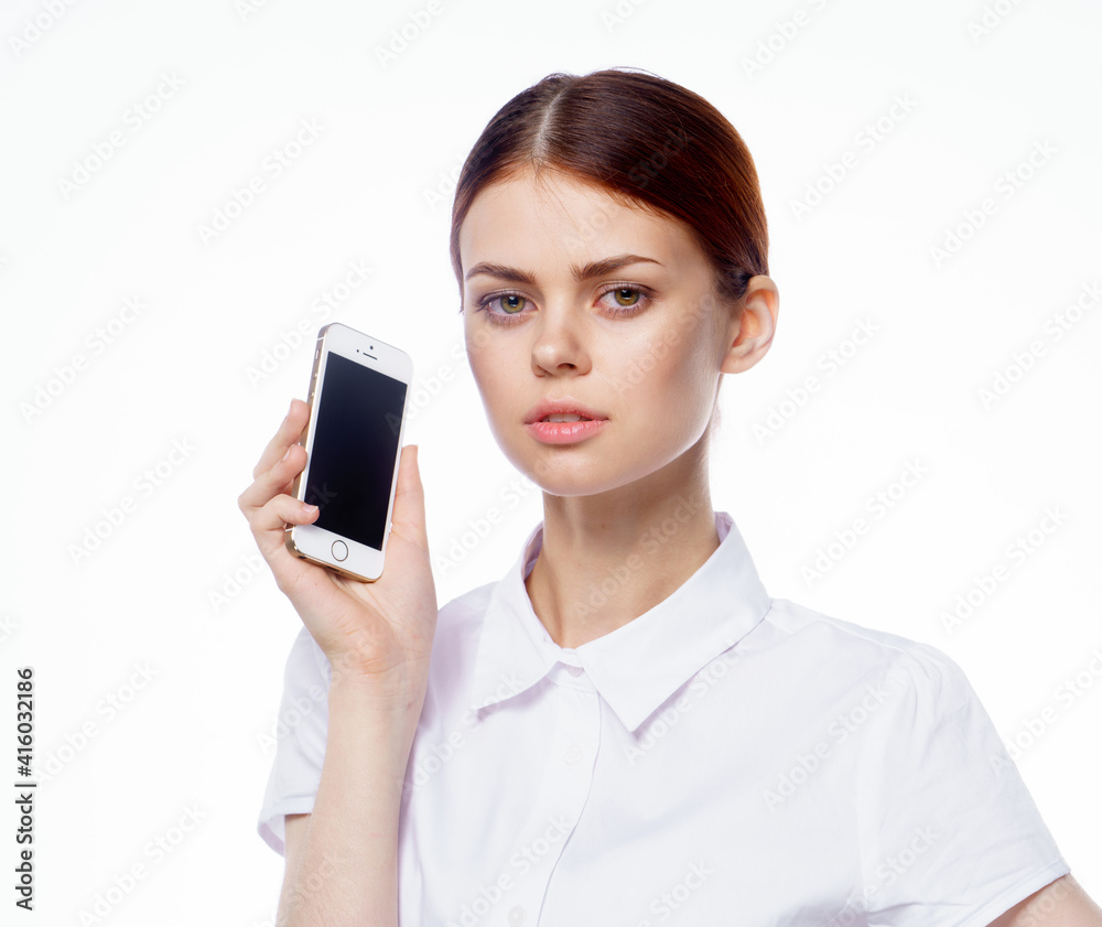woman in shirt with phone in hands technology secretary woman in shirt with phone in hands technology secretary