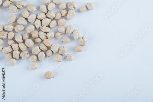 Heap of raw white peas on a white background
