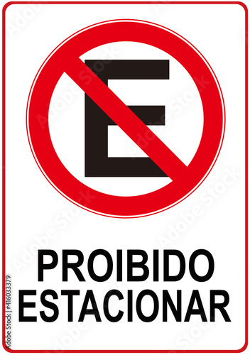 A sign that says in Portuguese language : parking is prohibited. No parking.