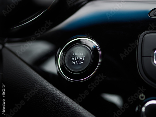 Close up engine car start button. Start stop engine modern new car button.