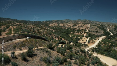 Aerial view of Nogales border area showing border fence separating the United States of America and Mexico with U.S. Border and Customs Protection patrolling border area with their vehicles