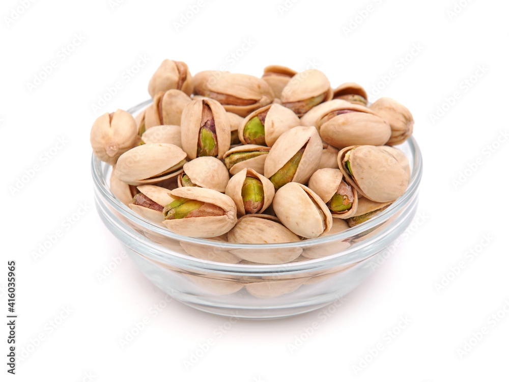 Salted pistachios in a glass bowl isolated on white
Salted pistachios in a glass bowl isolated on white