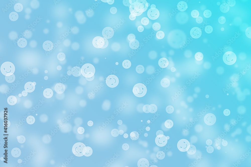 Bokeh background with happy face theme on blue colour.
