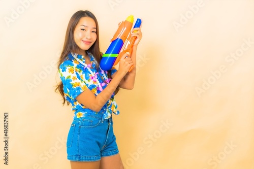 Portrait beautiful young asian woman wear colorful shirt for songkran festival