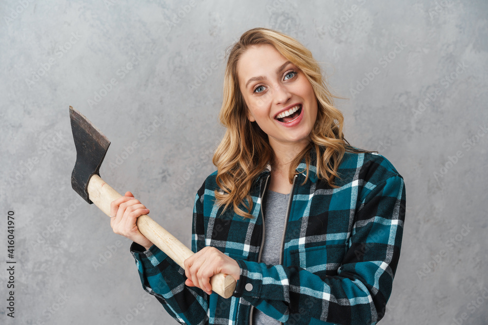 Αυτοκόλλητο Happy beautiful woman smiling while posing with hatchet