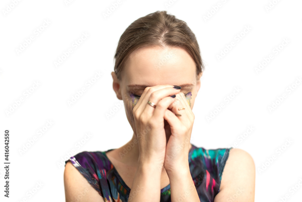 Woman in depression, bad emotions concept. Portrait of a woman with multi-colored tears on a white background. Woman in depression, bad emotions concept. Portrait of a woman with multi-colored tears on a white background.