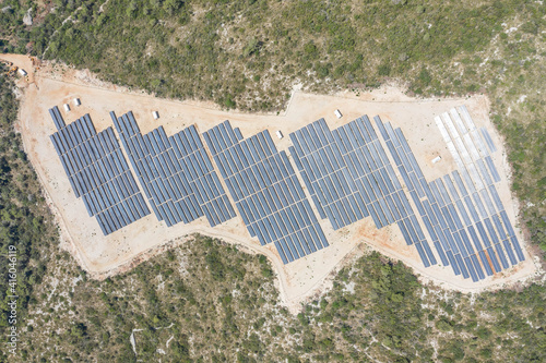 Aerial overhead drone shot of solar panels on hill near Zena Glava village on Vis Island in Croatia summer photo