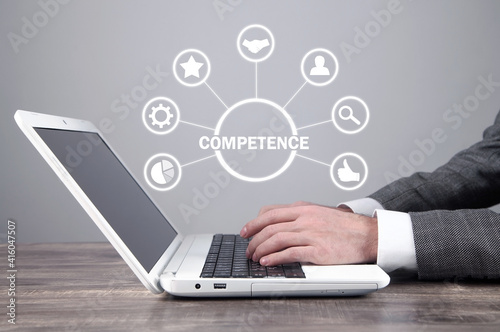 Businessman using laptop computer. Competence concept
