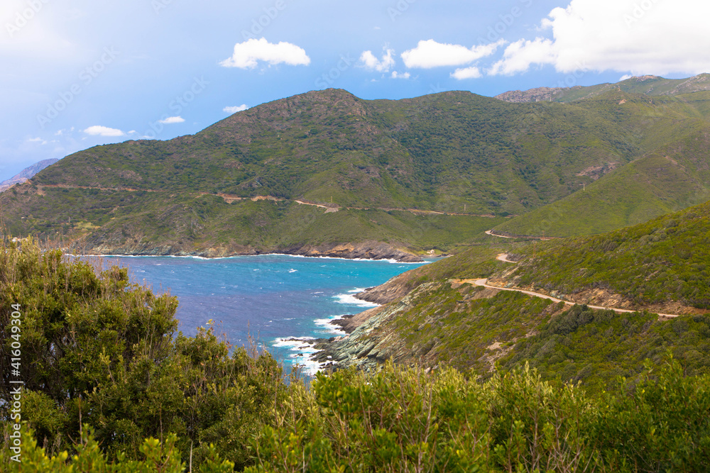 Panorama view of the rocky coastline of corsican Cap Corse near Erbalunga, Corsica, France. Tourism and vacations concept. Panorama view of the rocky coastline of corsican Cap Corse near Erbalunga, Corsica, France. Tourism and vacations concept.