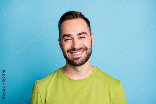 Photo of happy charming young attractive man beaming smile good mood isolated on pastel blue color background © deagreez