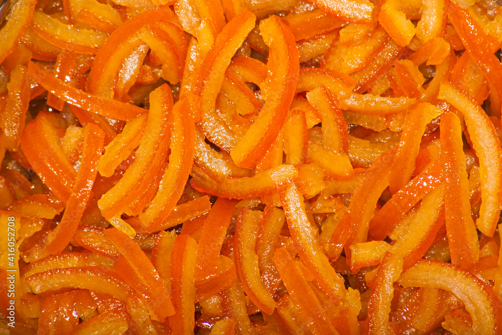 Candied orange peel. Succade is the candied orange peel. Background Candied orange peel. Succade is the candied orange peel. Background