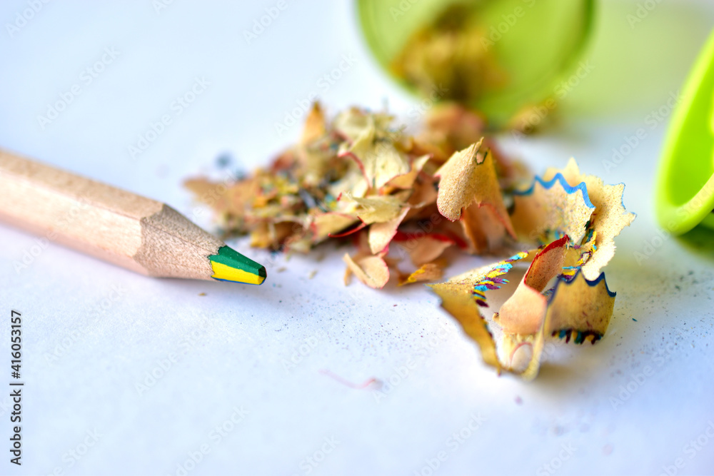 Pencil and sharpener with garbage on a white background Pencil and sharpener with garbage on a white background