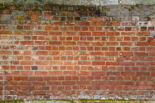 old grungy red brick wall surface with moss, Building Facade, Suffolk UK