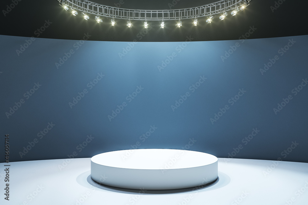 White round podium on light floor in empty hall with dark wall and led lights