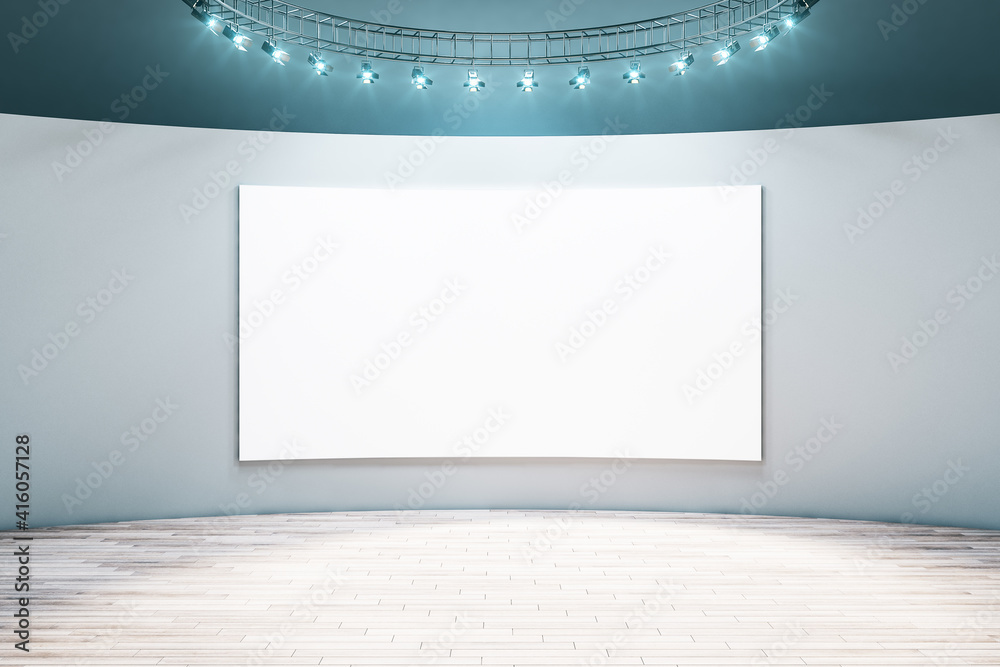 Spacious empty hall room with blank white poster on light wall, parquet floor and led light on top. Mockup