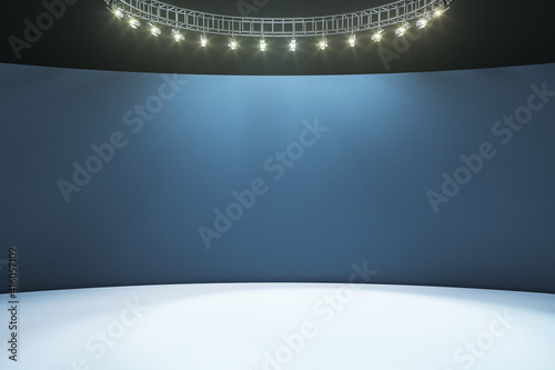 Empty hall room with dark blank wall, white floor and led light on top. Mockup © Who is Danny