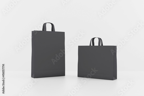 Blank black paper bags with a space for your logo. Mock up
