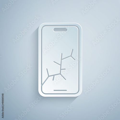 Paper cut Smartphone with broken screen icon isolated on grey background. Shattered phone screen icon. Paper art style. Vector.