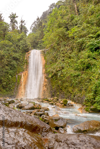 Blue water flowing through Gemelas waterfalls in Bajos del Toro, Costa Rica