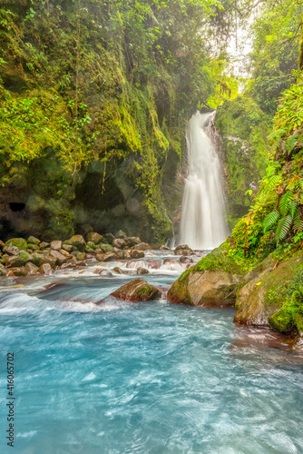 Blue water flowing through Gemelas waterfalls in Bajos del Toro, Costa Rica