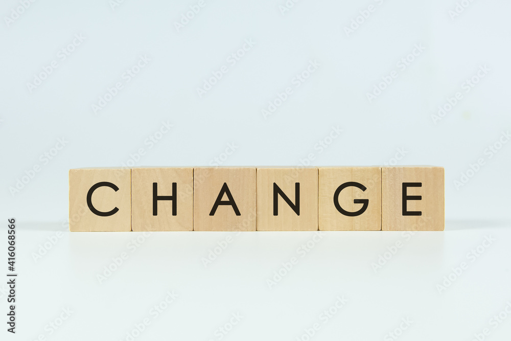 'CHANGE' text on wooden block with white backgrounds. 'CHANGE' text on wooden block with white backgrounds.