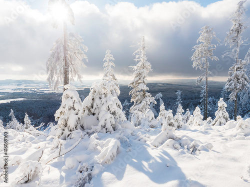 Beatiful winter landscape, view of Cakova vyhlidka viewpoint at fields, forest, villages and snowy spruce tree with snow covered branches. Brdy Mountains, Hills in central Czech Republic, sunny day © Kristyna