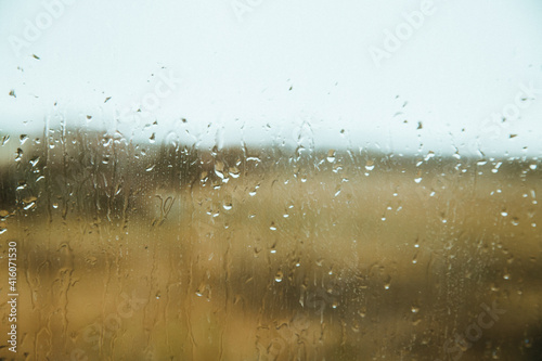 Raindrops on the window. Autumn or spring. Background and texture.
