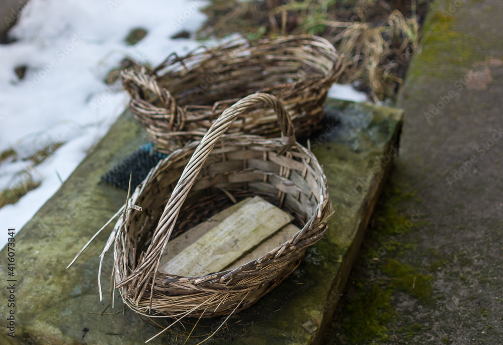 old wicker baskets on the ground