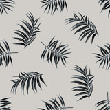 Seamless pattern with hand drawn stylized tropical palm leaves