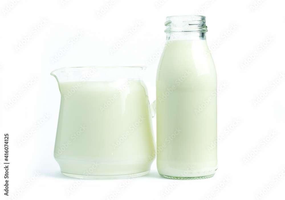 Pure milk beverage in clear jars and bottles is a natural, healthy, white background with clipping path. Pure milk beverage in clear jars and bottles is a natural, healthy, white background with clipping path.