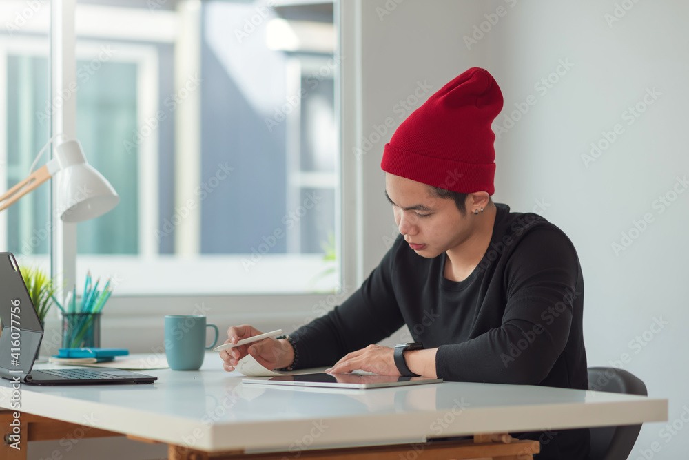 Asian business designer man working in the office. Asian business designer man working in the office.