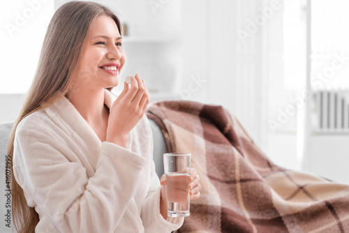 Beautiful young woman takin...