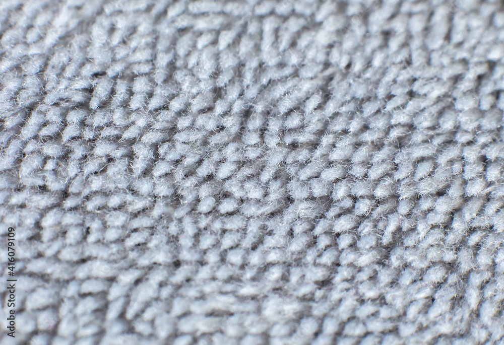 Grey cotton towel or carpet.fluffy texture background. Close up photo. Grey cotton towel or carpet.fluffy texture background. Close up photo.