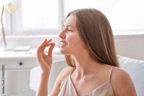 Beautiful young woman takin...