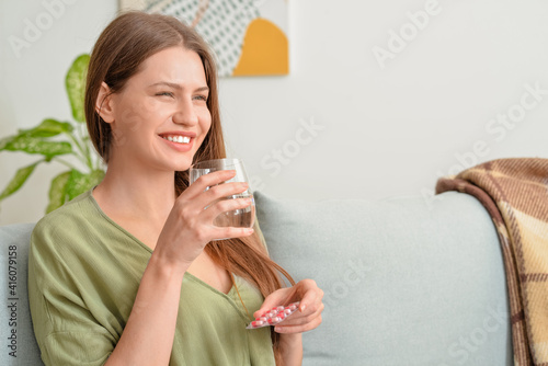 Beautiful young woman takin...