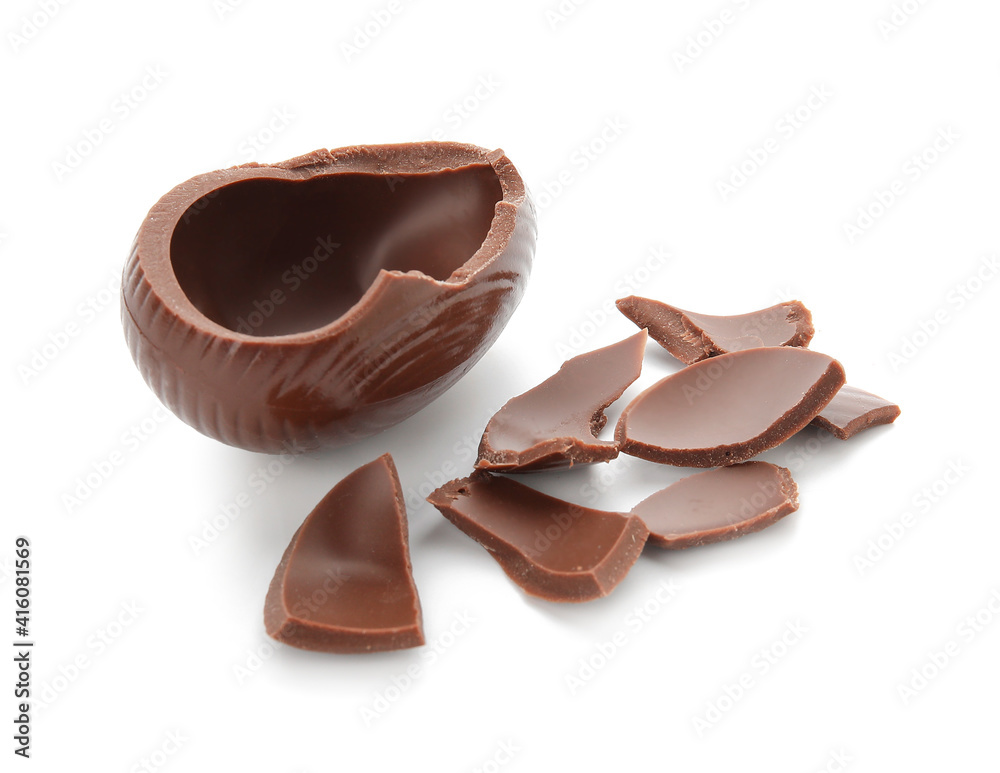 Broken chocolate Easter egg on white background Broken chocolate Easter egg on white background